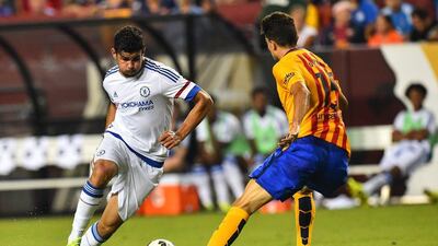 Chelsea's Diego Costa tries to beat Barcelona defender Marc Bartra one-on-one in Tuesday's pre-season International Champions Cup friendly. Nicholas Kamm / AFP