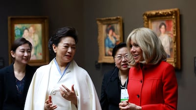 Ms Peng and Ms Macron inside the Orsay Museum. AFP