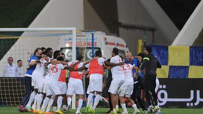 Al Jazira players and staff celebrate after defeating Al Dhafra on penalty kicks in their League Cup semi-final match on March 15, 2014. Courtesy Abdullateef Al Marzouqi / Al Ittihad
