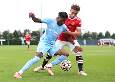 Dire Mebude of Manchester City battles for possession with Sam Murray of Manchester United during their U-18 at Manchester City Football Academy on August 14, 2021. Getty