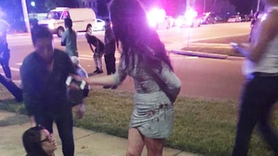 Patrons from the Pulse Nightclub in Orlando, Florida, ran for the exits after a gunman opened fire inside the club on June 12, 2016. Univision Florida Central / EPA