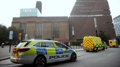 Police at the Tate Modern art gallery after the boy was thrown 30 metres from a balcony. Yui Mok/PA via AP