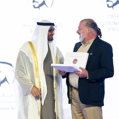 President Sheikh Mohamed presents the Zayed Sustainability Prize in the health category to Dr Ricardo Ferreira, who provides specialised care for indigenous people. Photo: Presidential Court
