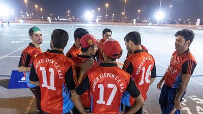 A competing team talk strategy at the Ramadan street cricket tournament.