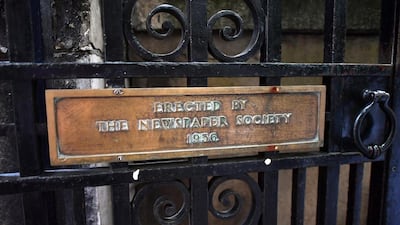 A plaque is displayed on a gate at St Bride's Church, still the spiritual home of the UK media, in Fleet Street. But now, with the advent of digital media and purpose built printing presses, the newspapers and agencies have moved to more modern offices around London. Carl Court / Getty Images