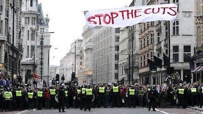 Police in London hold back demonstrators as they protest against the government's austerity measures in March. Paul Hackett / Reuters