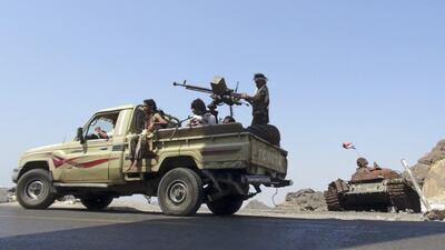 Militants loyal to Yemen's government patrol a road in the country's southern port city of Aden as the Saudi-led coalition helps the government flush out Houthi rebels elsewhere in Yemen. October 19, 2015. Reuters