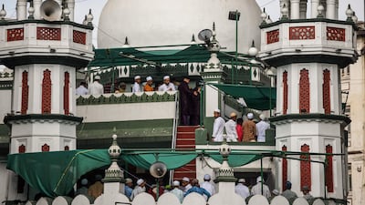Worshippers offer morning prayers to start Eid Fitr at the Gol Masjid mosque in Mumbai. AFP