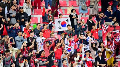 South Korea supporters celebrate their win during the 2019 AFC Asian Cup Round of 16 football match between South Korea and Bahrain at the Rashid Stadium in Dubai on January 22, 2019. / AFP / Giuseppe CACACE