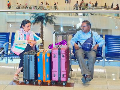 People wait for their flight after a rainstorm hits Dubai, causing delays at Dubai International Airport. Reuters