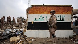 Iraqi soldiers inspect the site of a health centre in the Habbaniyah military base which was hit by a US-Israeli air strike west of Baghdad. AFP