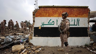 Iraqi soldiers inspect the site of a health centre in the Habbaniyah military base which was hit by a US-Israeli air strike west of Baghdad. AFP