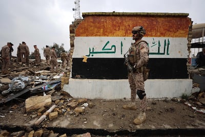Iraqi soldiers inspect the aftermath of an air strike on the Habbaniyah military base, west of Baghdad, on March 26, 2026. AFP