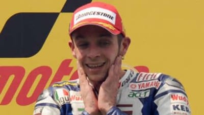 Italian rider Valentino Rossi of Fiat Yamaha Team smiles at the prize presentation after the Malaysian MotoGP.