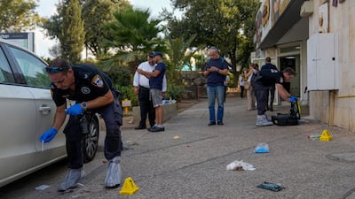 Israeli police inspect the site of a shooting attack in the West Bank Jewish settlement of Maale Adumim on Tuesday. AP