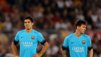 Luis Suarez and Lionel Messi of Barcelona react during their side's 1-1 draw with AS Roma in the Champions League on Wednesday night. Paolo Bruno / Getty Images / September 16, 2015
