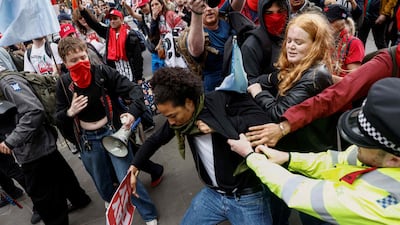 Police and protesters face off during a May Day march in London last month. The abundance of veto points makes sustained strategic continuity substantially harder to achieve in countries like Britain. AFP