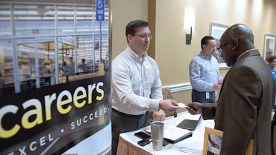 Job growth in the United States was slightly down last month, bu the three-month average is still strong. Matthew Busch / Bloomberg