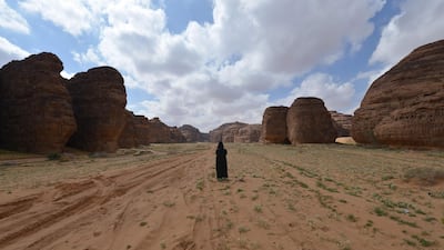 A Saudi woman walks in the Sharaan Nature Reserve near the town of Al Ula in northwestern Saudi Arabia. AFP