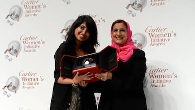 Iba Masood, left, receives the Cartier award for the Mena region from Sheikha Lubna. Courtesy Cartier