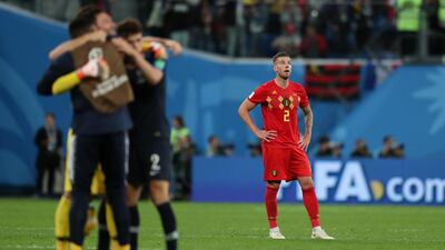 Belgium's Toby Alderweireld looks on while France celebrate their win. Getty Images