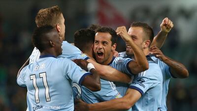 Alex Brosque, centre, celebrates with teammates after scoring his first goal in the A-League semi-final against Adelaide United. Mark Kolbe / Getty