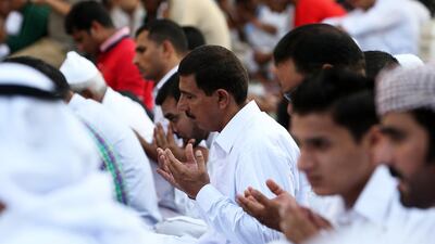 Worshippers came from all over to attend morning prayers in Dubai on the first day of Eid Al Fitr. Pawan Singh / The National