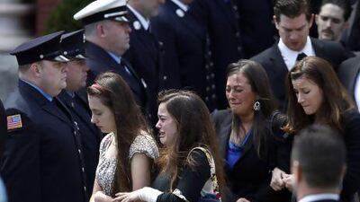 Mourners leave the funeral for Boston Marathon bomb victim Krystle Campbell, 29, at St. Joseph's Church in Medford.