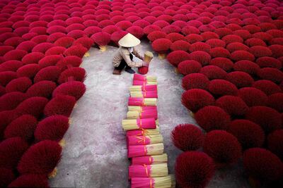 A Vietnamese woman collecting incense sticks in village on the outskirts of Hanoi. AFP