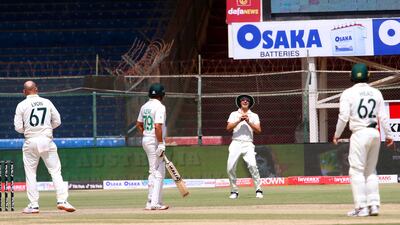 Australia's Pat Cummins, second right, takes the catch to dismiss Pakistan batsman Imam Ul Haq for 20. EPA