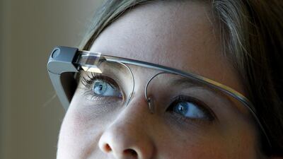 Grace Petersen, who supports the Google Glass team, dons the Google Glass - the company’s latest wearable tech that is in fact a wearable computer with an optical head mounted display. It is activated by hand gestures and simple voice commands. Jeffrey E Biteng / The National