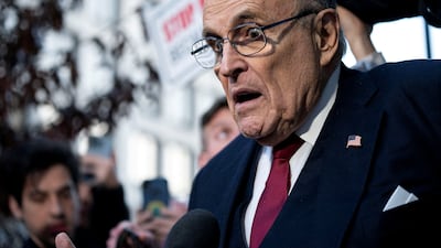 Former New York mayor Rudy Giuliani departs a courthouse after he was ordered to pay $148 million in a defamation case. Reuters