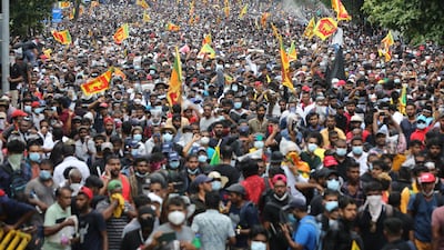 People attend an anti-government protest rally near the President's house in Colombo earlier in July. EPA