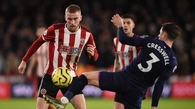 Sheffield United's Oliver McBurnie (L) faces West Ham United defender Aaron Cresswell. AFP