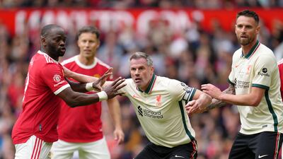 United's Louis Saha and Liverpool's Jamie Carragher during the Legends match at Old Trafford. PA