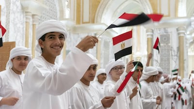 School children take part in an Egyptian state visit reception, at Qasr Al Watan. Seen with Sheikh Rashid bin Hamdan bin Zayed Al Nahyan (L). Mohamed Al Hammadi / Ministry of Presidential Affairs