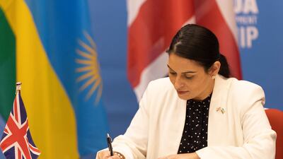 Four activists stood up and made statements at a dinner attended by UK Home Secretary Priti Patel. EPA