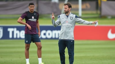 England U21 manager Gareth Southgate directs his side as Ruben Loftus-Cheek looks on during a training session on Tuesday at St George's Park. Michael Regan / Getty Images