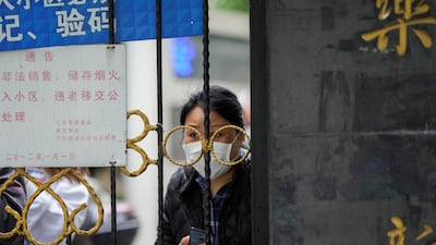 A Shanghai resident waits for delivery of food. Reuters