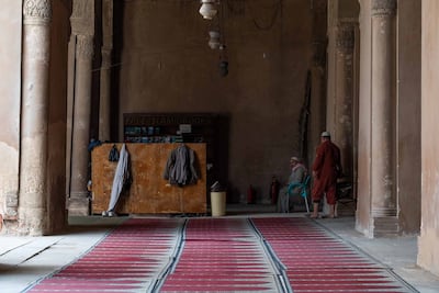 People prays inside the mosque of Ibn Tulun in Cairo. Mahmoud Nasr / The National