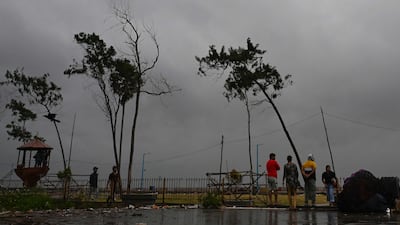 Dark clouds loom off the coast of Digha, West Bengal, on Thursday as Cyclone Dana approaches. AFP