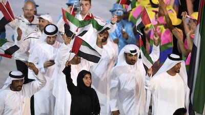 Flag-bearer Nada Al-Bedwawi of United Arab Emirates leads her contingent during the opening ceremony. Dylan Martinez / Reuters