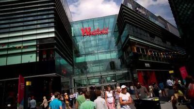 The upmarket Westfield shopping centre in Stratford, a poor area in east London, is touted as one of the benefits of the London Olympics. Andrew Cowie /AFP