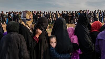 Ivor Prickett: Civilians who had remained in west Mosul during the battle to retake the city, lined up for an aid distribution in the Mamun neighbourhood. Iraq, March 2017. From the series: End of the Caliphate, 2016–2018. © Ivor Prickett, The New York Times