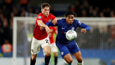 Manchester United's Daniel James, left, battles for possession with Reece James. Reuters