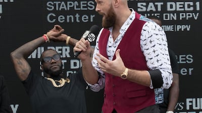 Tyson Fury speaks on Monday in Los Angeles about his fight with Deontay Wilder, left, which takes place on December 1. AP Photo