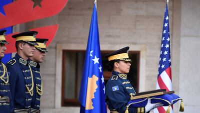 Kosovo's ceremonial guard carry the presidential medal during a presidential medal ceremony for Beau Biden. AFP
