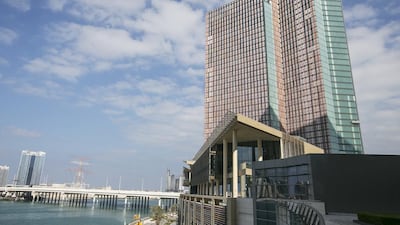 Mubadala’s Four Seasons hotel on Al Maryah Island opened in May. The company reported heavy losses for the first half of the year. Mona Al Marzooqi / The National