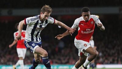 Arsenal’s Alex Iwobi and West Brom’s Craig Dawson in action. Eddie Keogh / Reuters