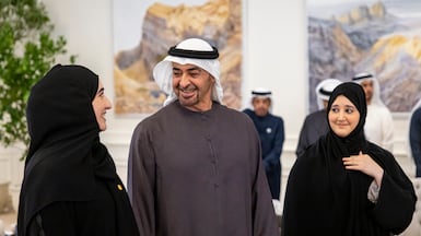 ABU DHABI, UNITED ARAB EMIRATES - July 21, 2026: HH Sheikh Mohamed bin Zayed Al Nahyan, President of the United Arab Emirates (C), receives distinguished Secondary School students, parents, teachers, and staff from the UAE Ministry of Education during a barza. ( Ryan Carter / UAE Presidential Court ) ---